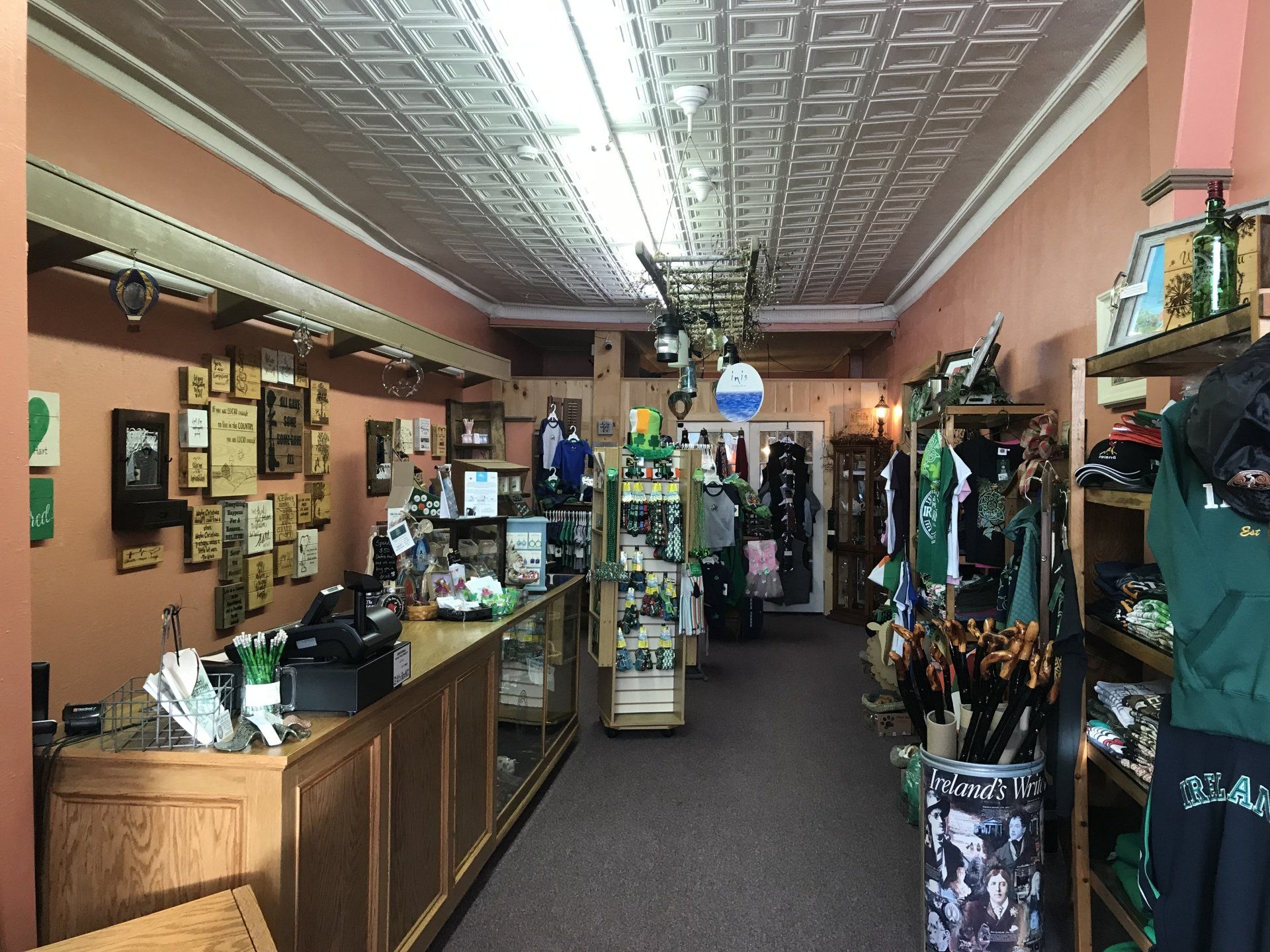 a store filled with lots of clothes and umbrellas