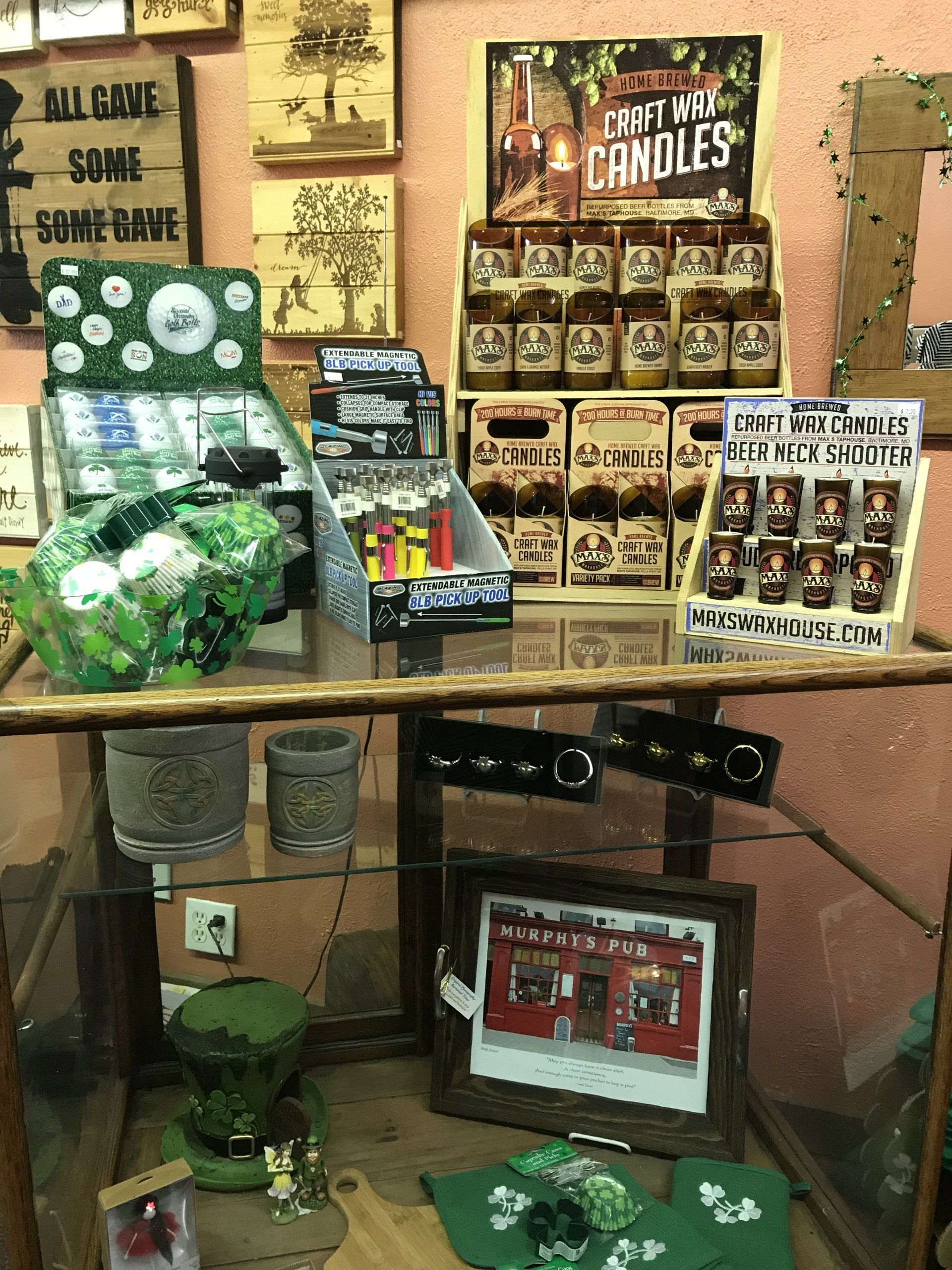 a display case filled with candles and other items