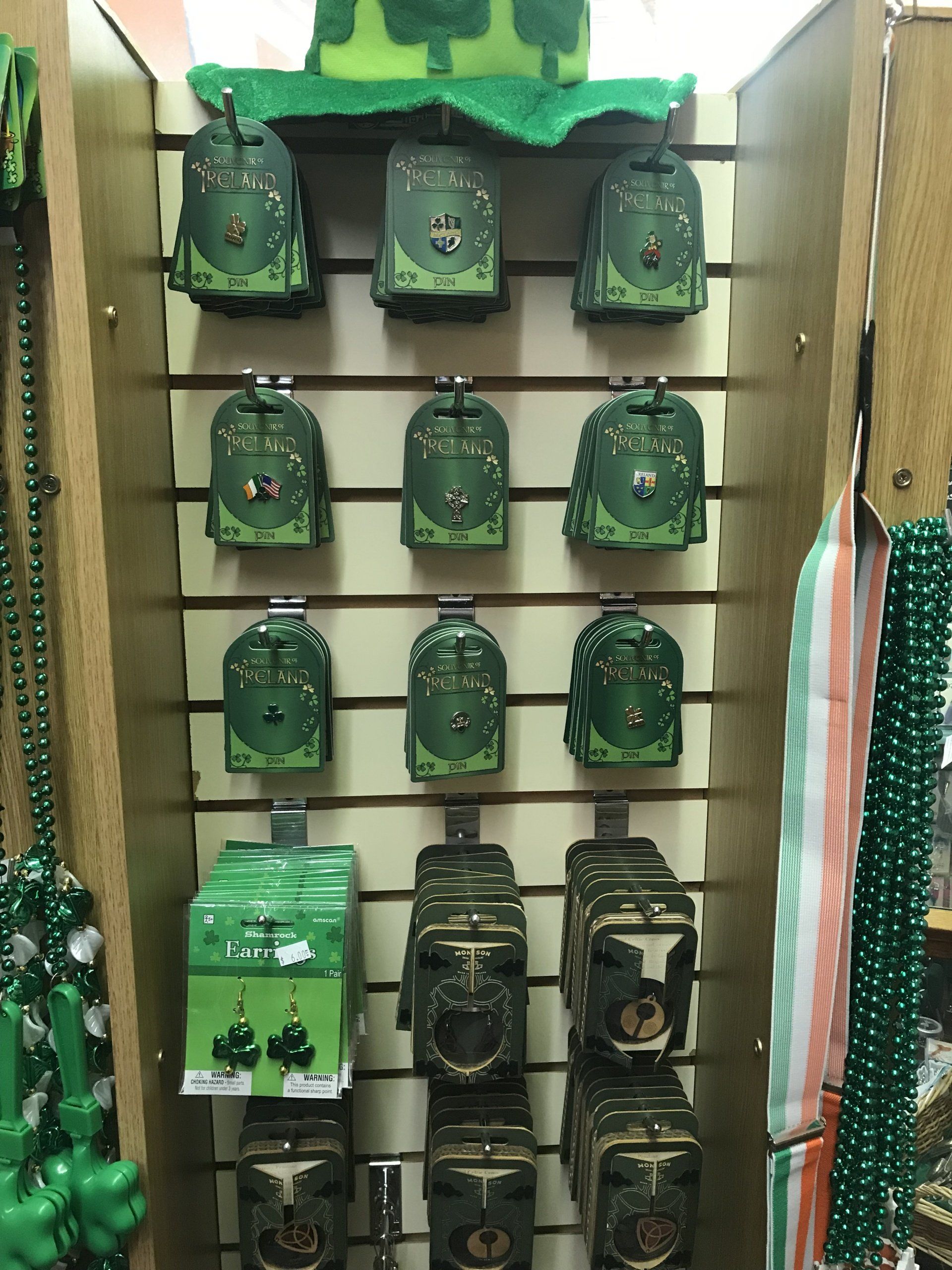 a wall with a bunch of green items on it