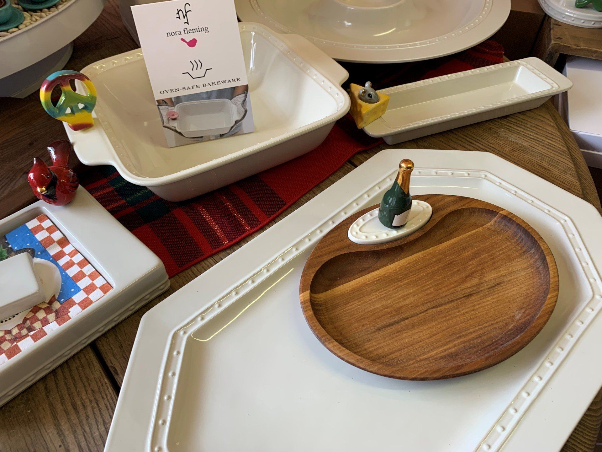a wooden plate with a bottle of champagne on top of it