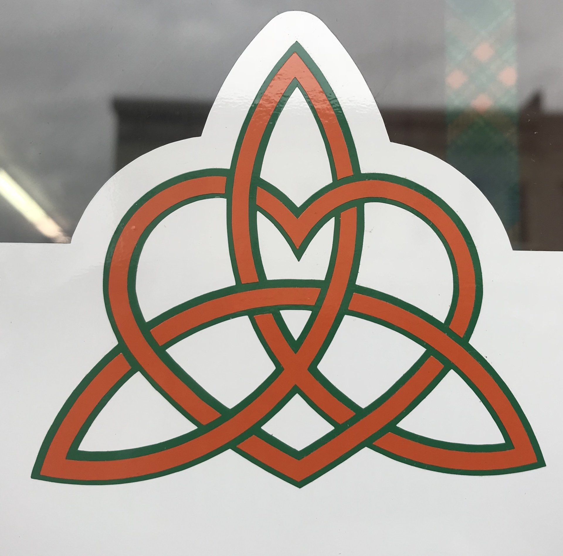 a celtic knot with a heart in the middle