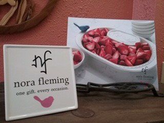 a sign that says nora fleming one gift every occasion