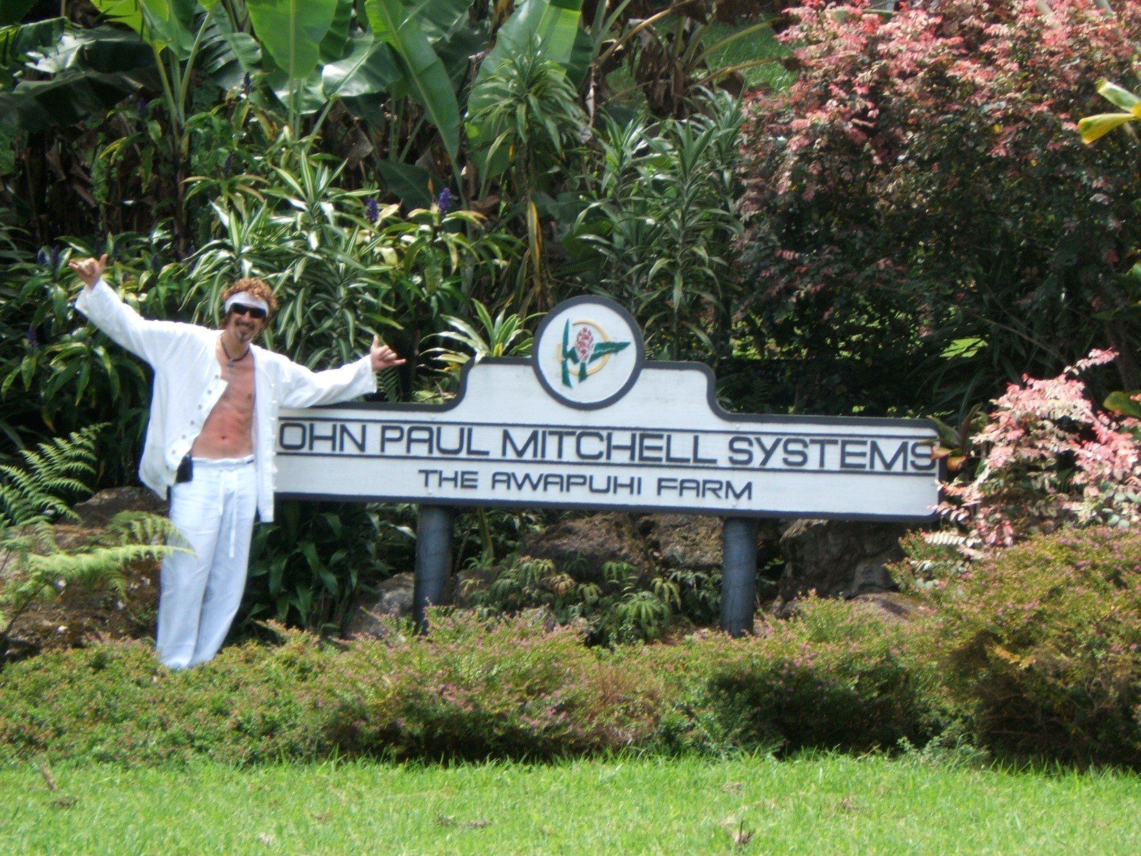 Man Standing Beside Sign Board – Longwood, FL – Salon Zion