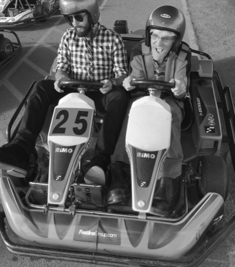 Black and white photos of clients and staff in go karts 