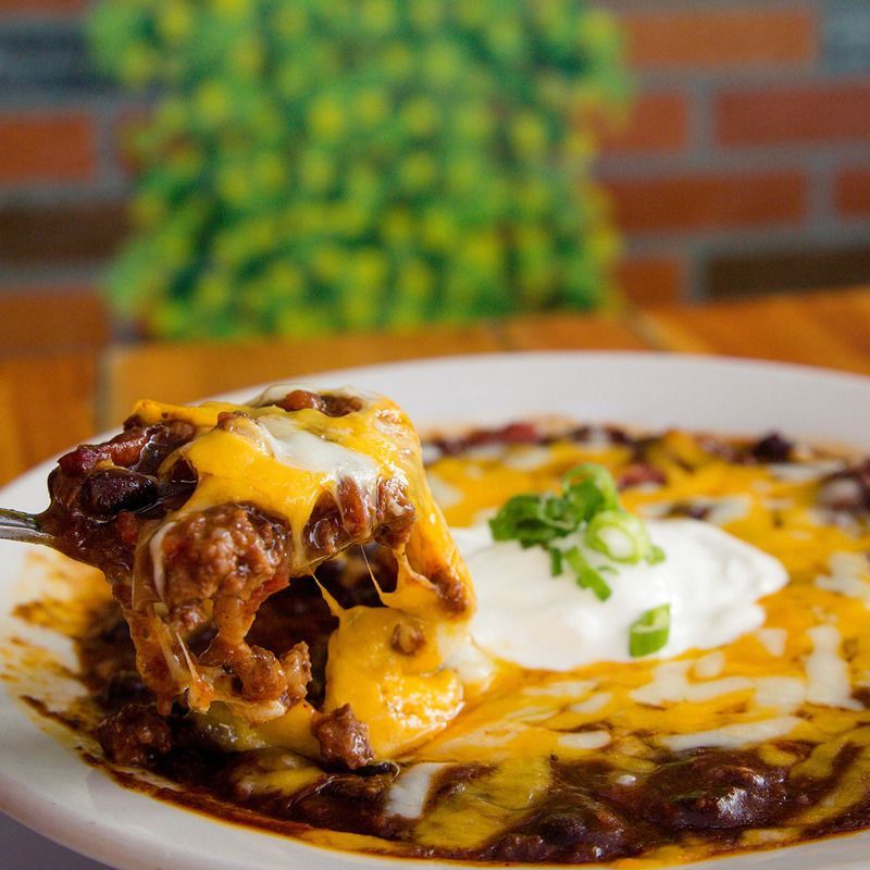 A close up of a plate of food with a fork in it