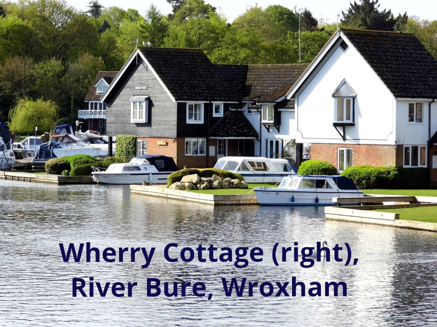Wherry Cottage on River Bure as seen from Wroxham Bridge