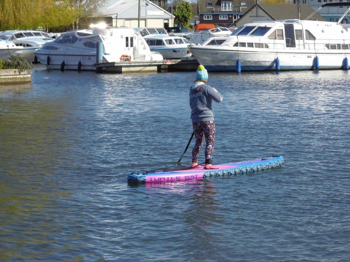 A paddle boarder on River Bure.