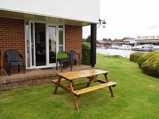 Garden terrace and picnic table at Wherry cottage