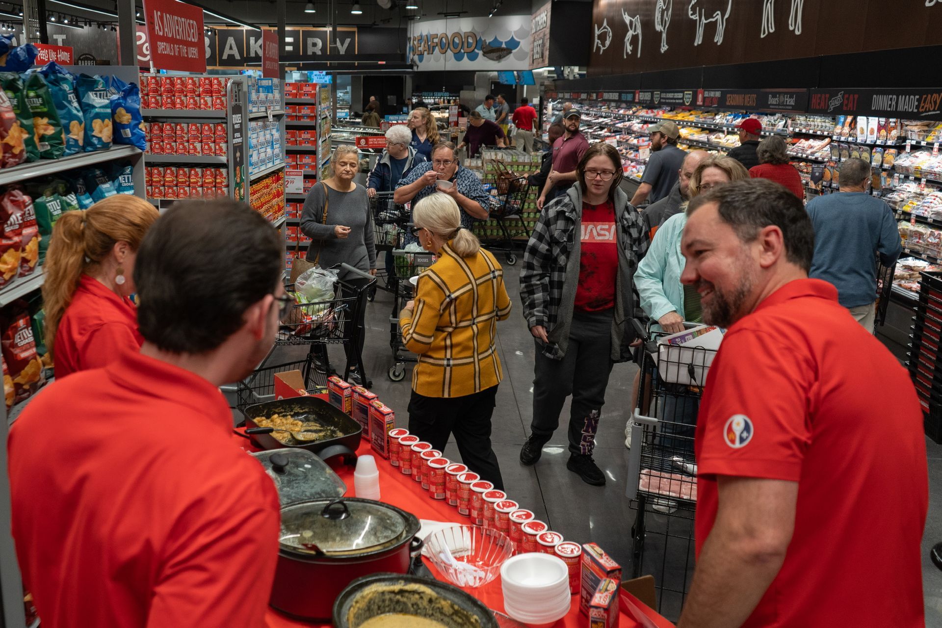 Acadian Kitchens team working a sample booth and local supermarket