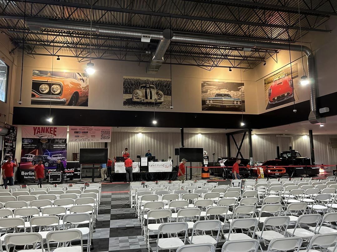 A large room filled with lots of chairs and tables.
