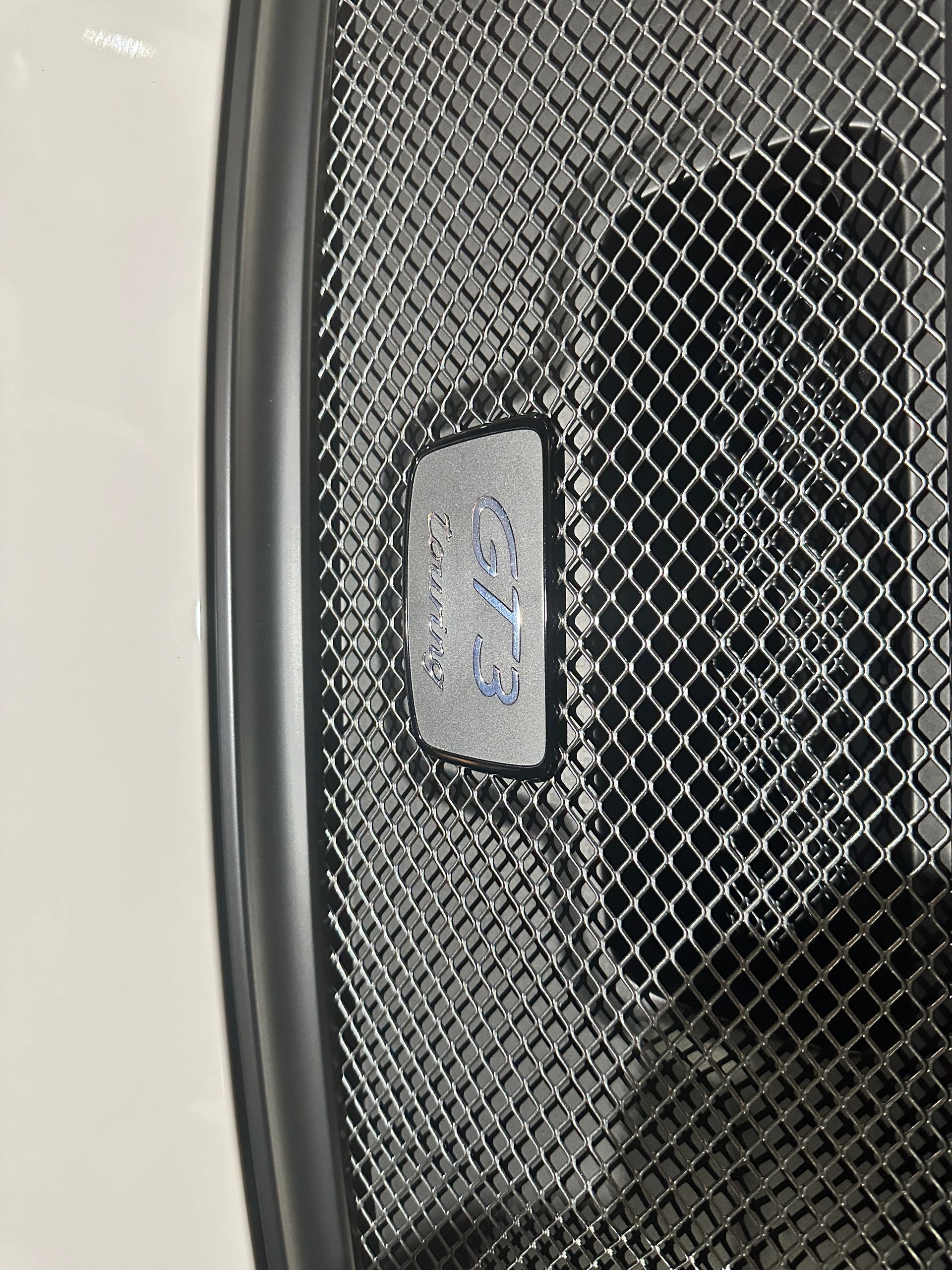A close up of a mesh grille on a chair.