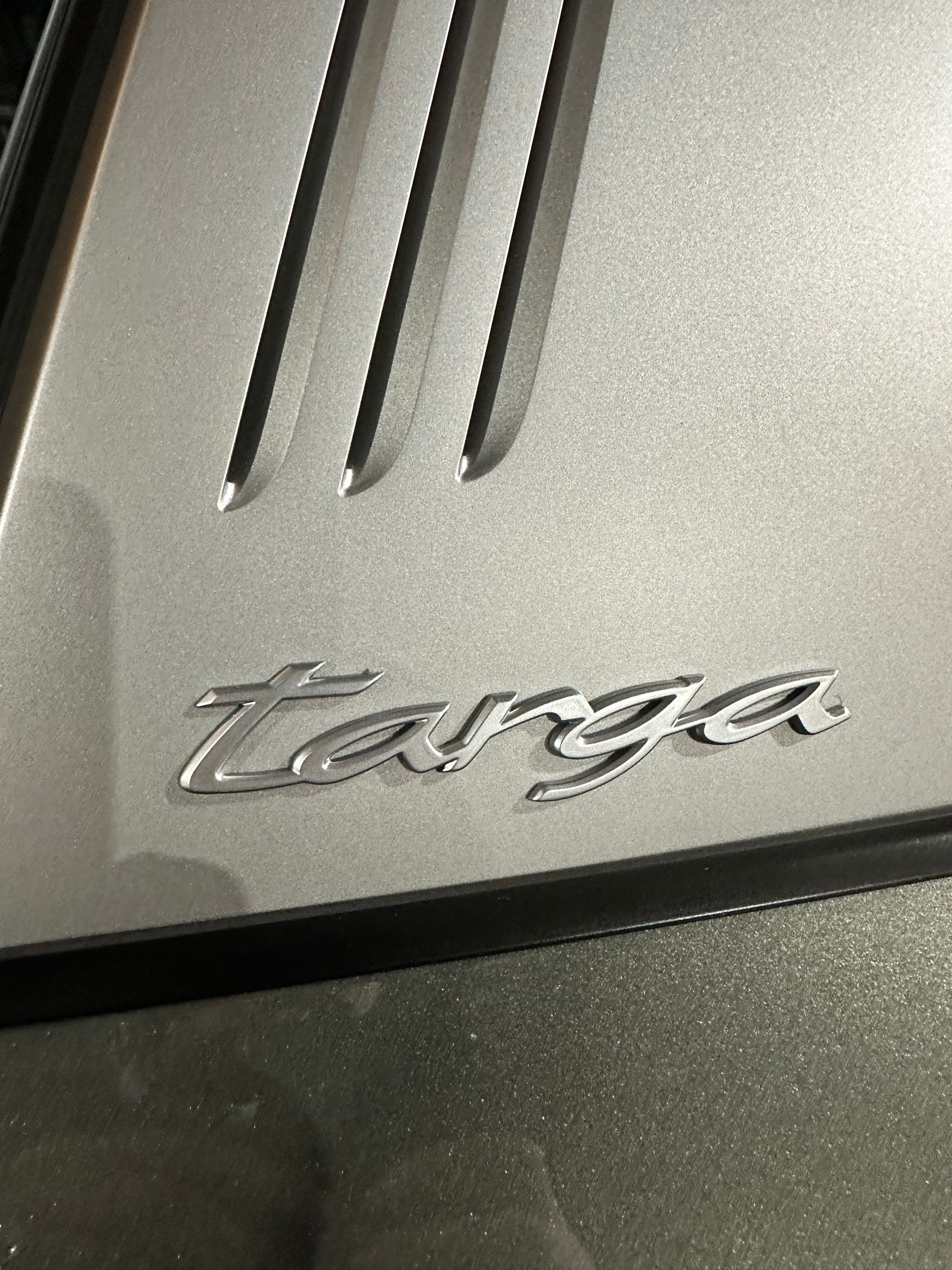 The word targa is on the side of a car