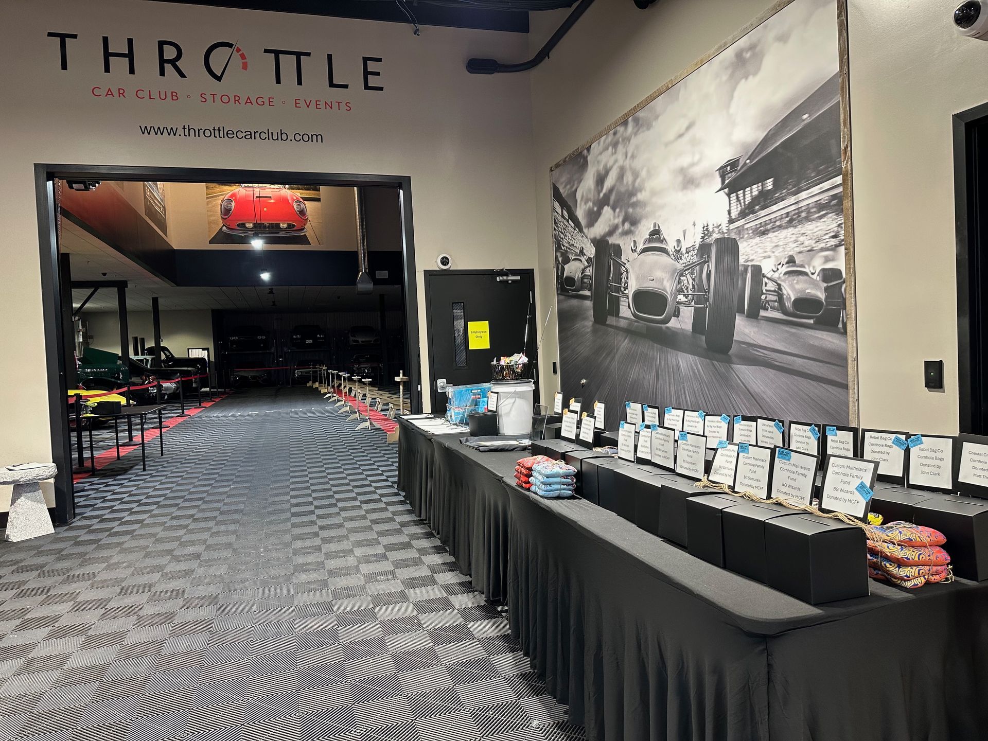 A long hallway with tables and a sign that says throttle