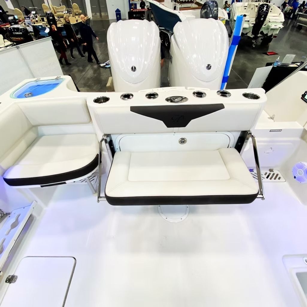 White boat stern with seating, cup holders, and storage compartments.