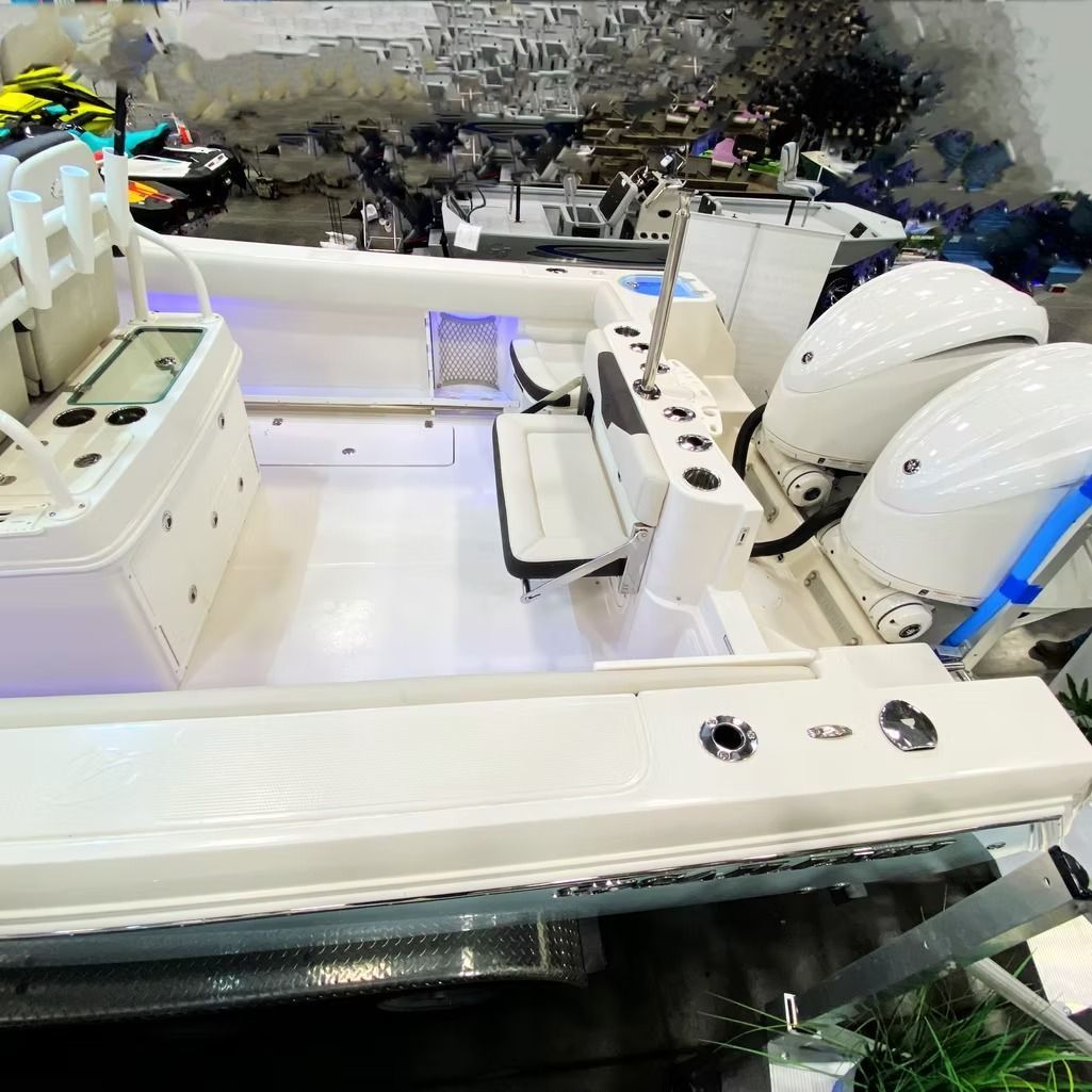 White motorboat with two outboard motors, in a harbor.