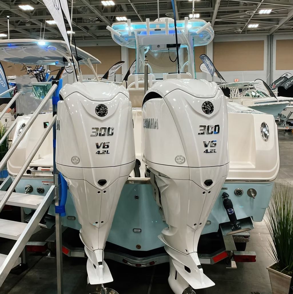 Two white boat engines labeled