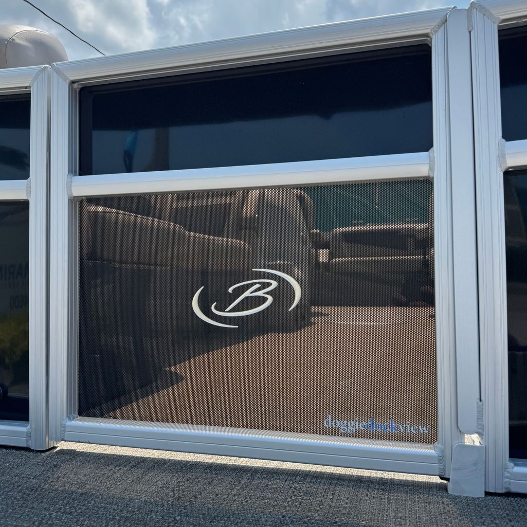Aluminum boat railing with black mesh and a white 