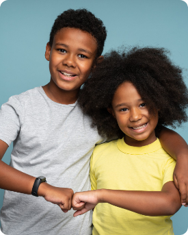 A boy and a girl are putting their fists together.