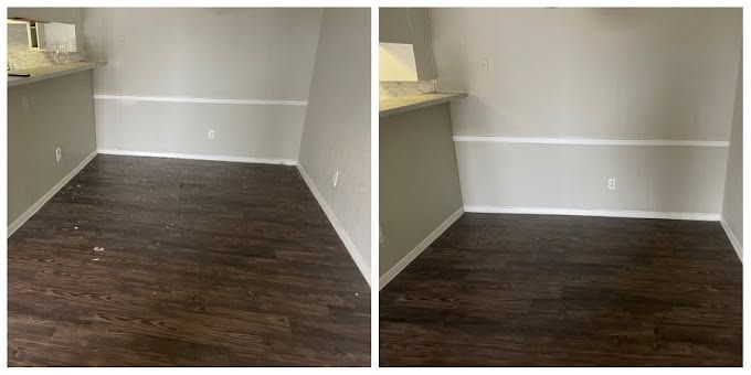 Empty room with dark wood floors, light walls, and a small countertop nook on the left
