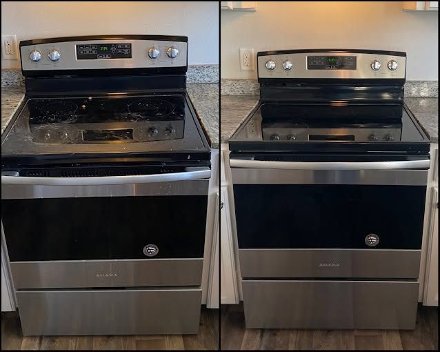 Two stainless steel stoves side by side in a kitchen, both with black glass tops and digital displays