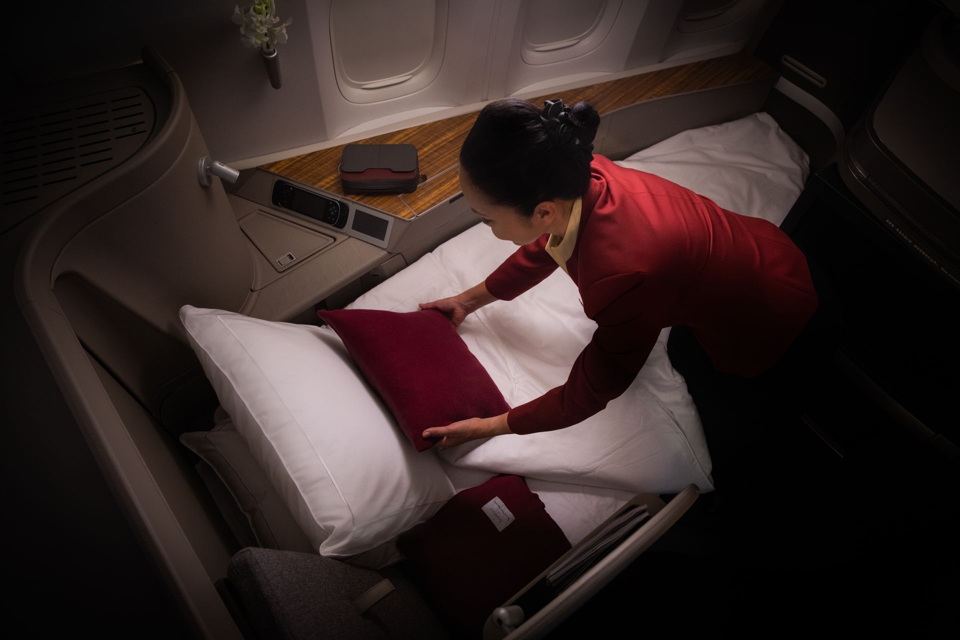 Cathay Pacific First Class suite with lie-flat bed and premium service, bookable from the UK with xLuxuryFlights.com