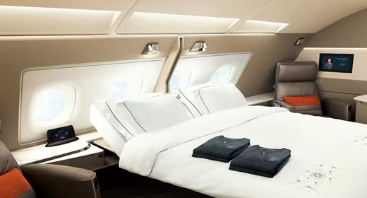 Singapore Airlines Suites and Business Class cabin with lie-flat beds and premium service, bookable from the UK with xLuxuryFlights.com