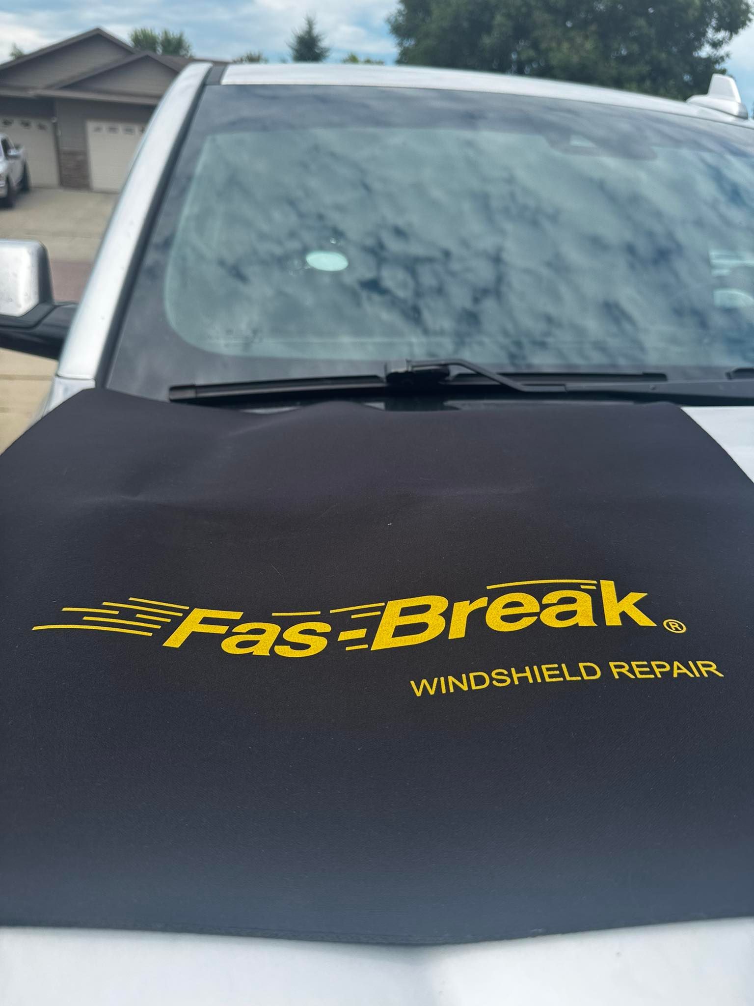 A black protective cover with the yellow logo 