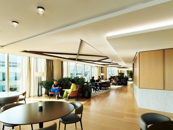 An artist 's impression of a large room with tables and chairs