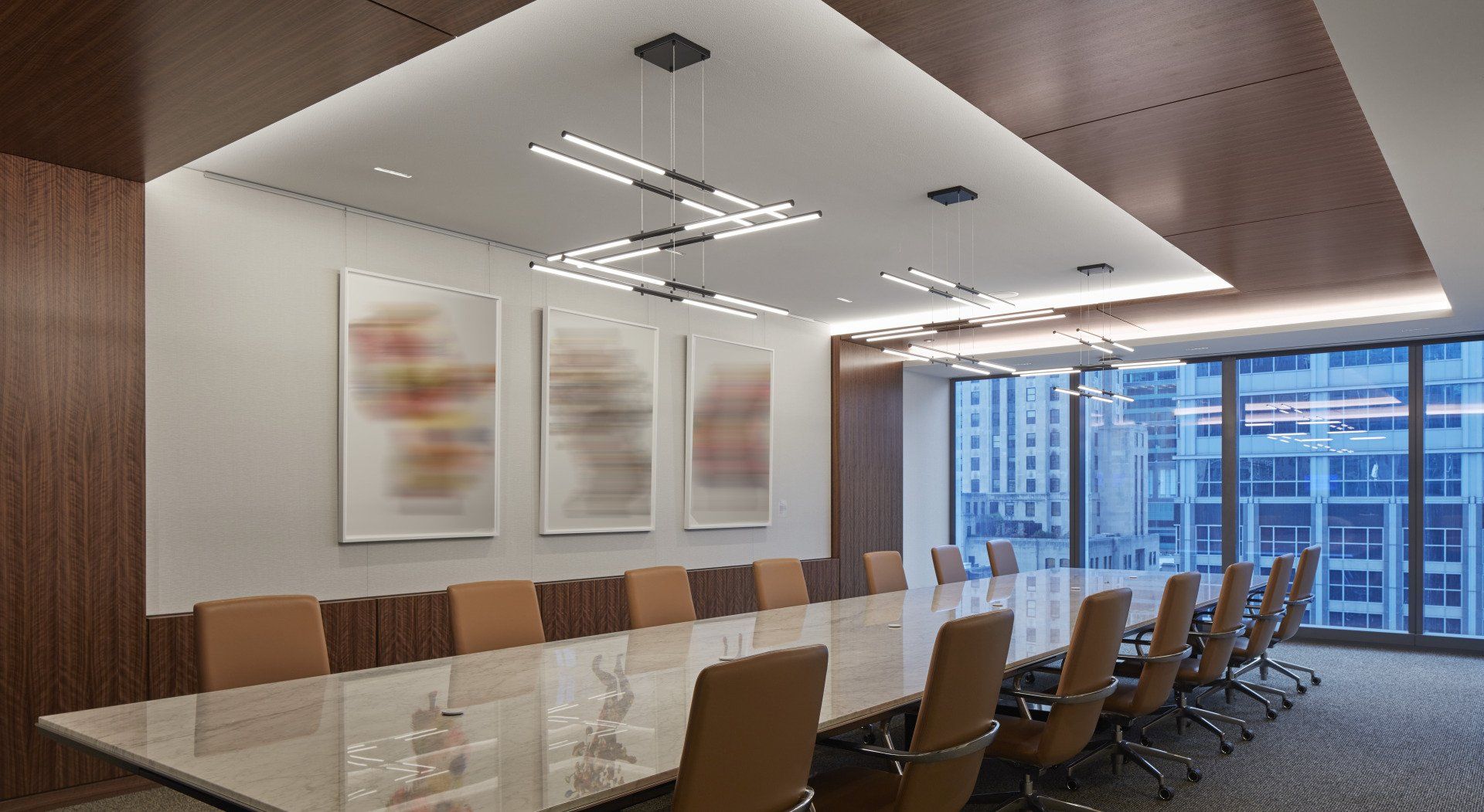 A large conference room with a long table and chairs.