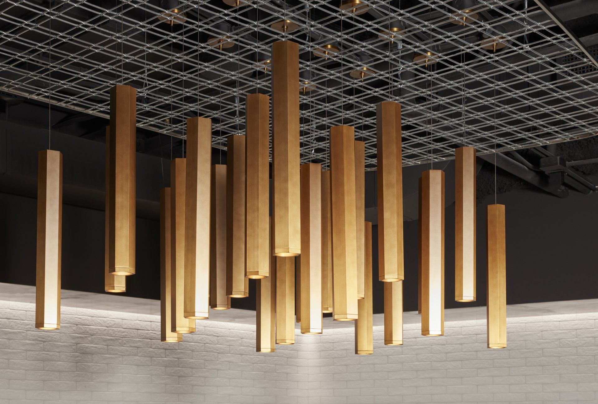 A ceiling with a bunch of wooden sticks hanging from it