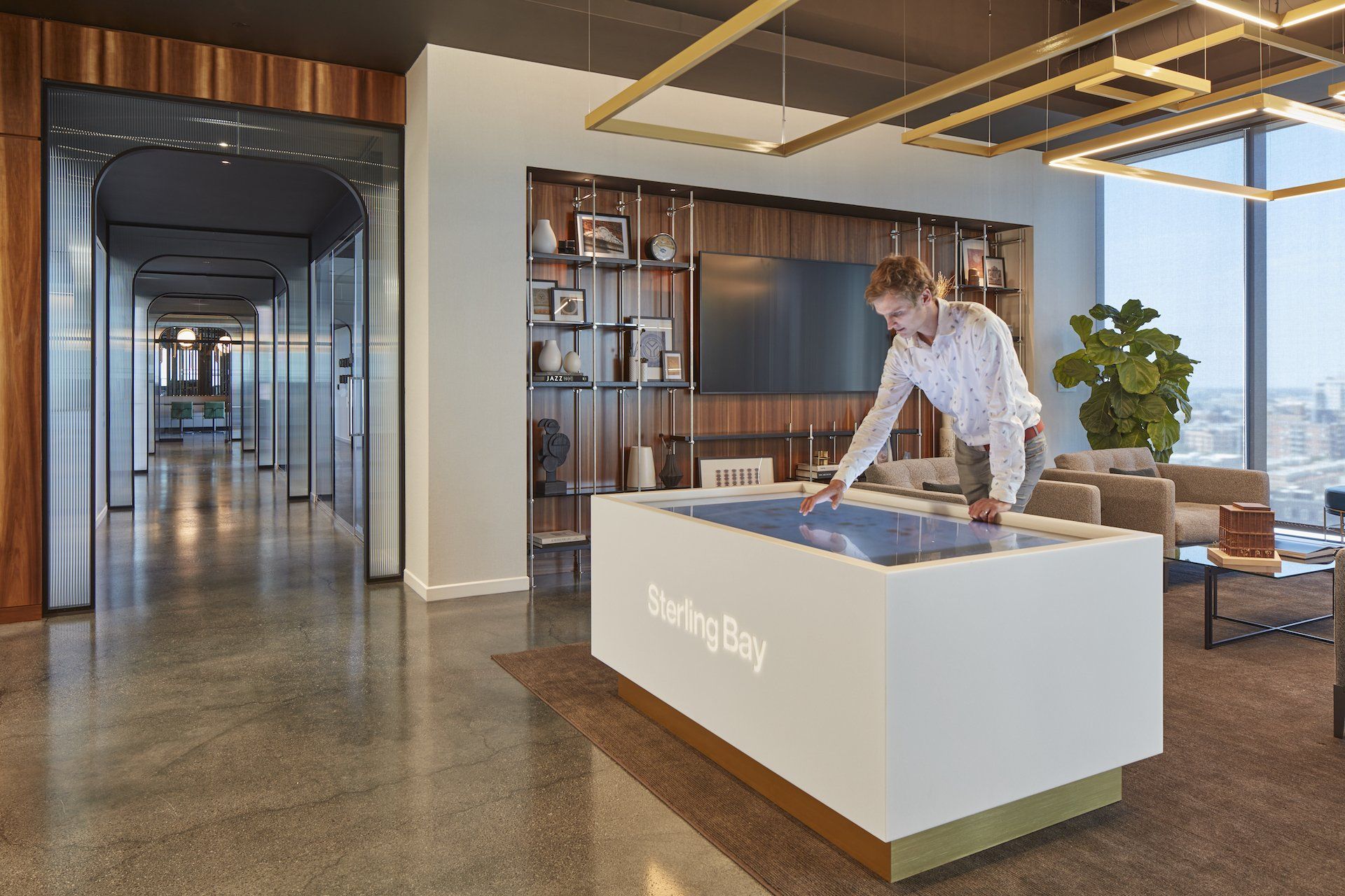 A man is playing a game on a table in a living room.