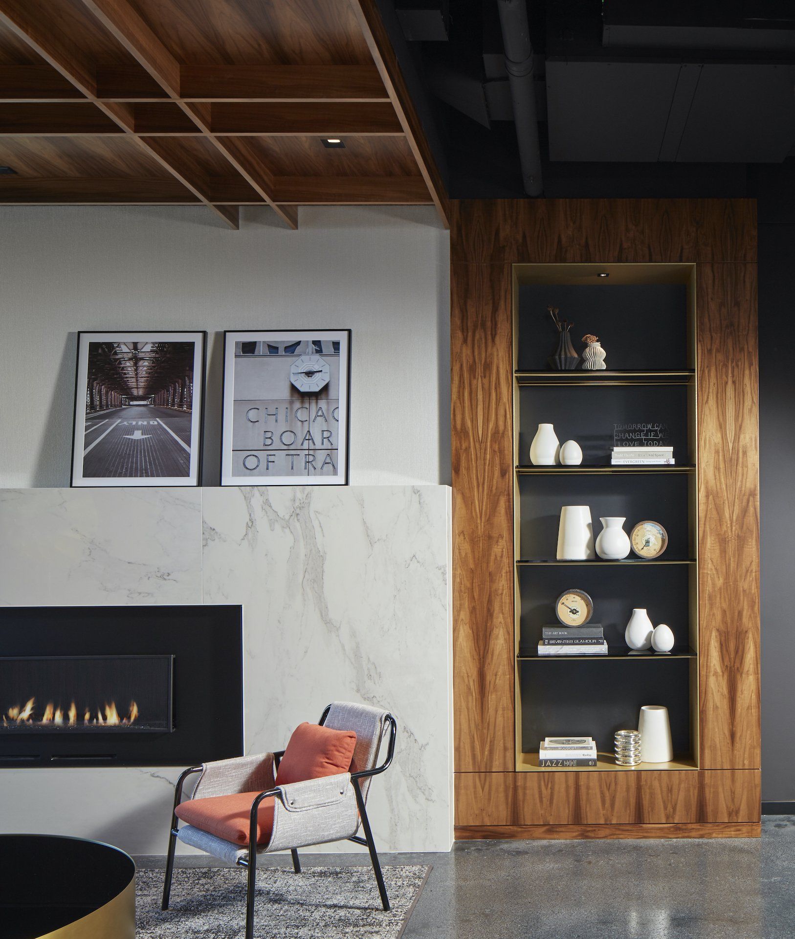 A living room with a fireplace and a chair