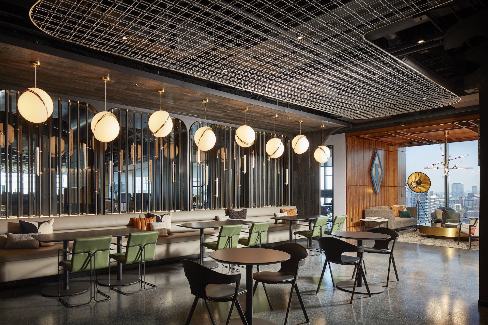 A restaurant with tables and chairs and a chandelier hanging from the ceiling.