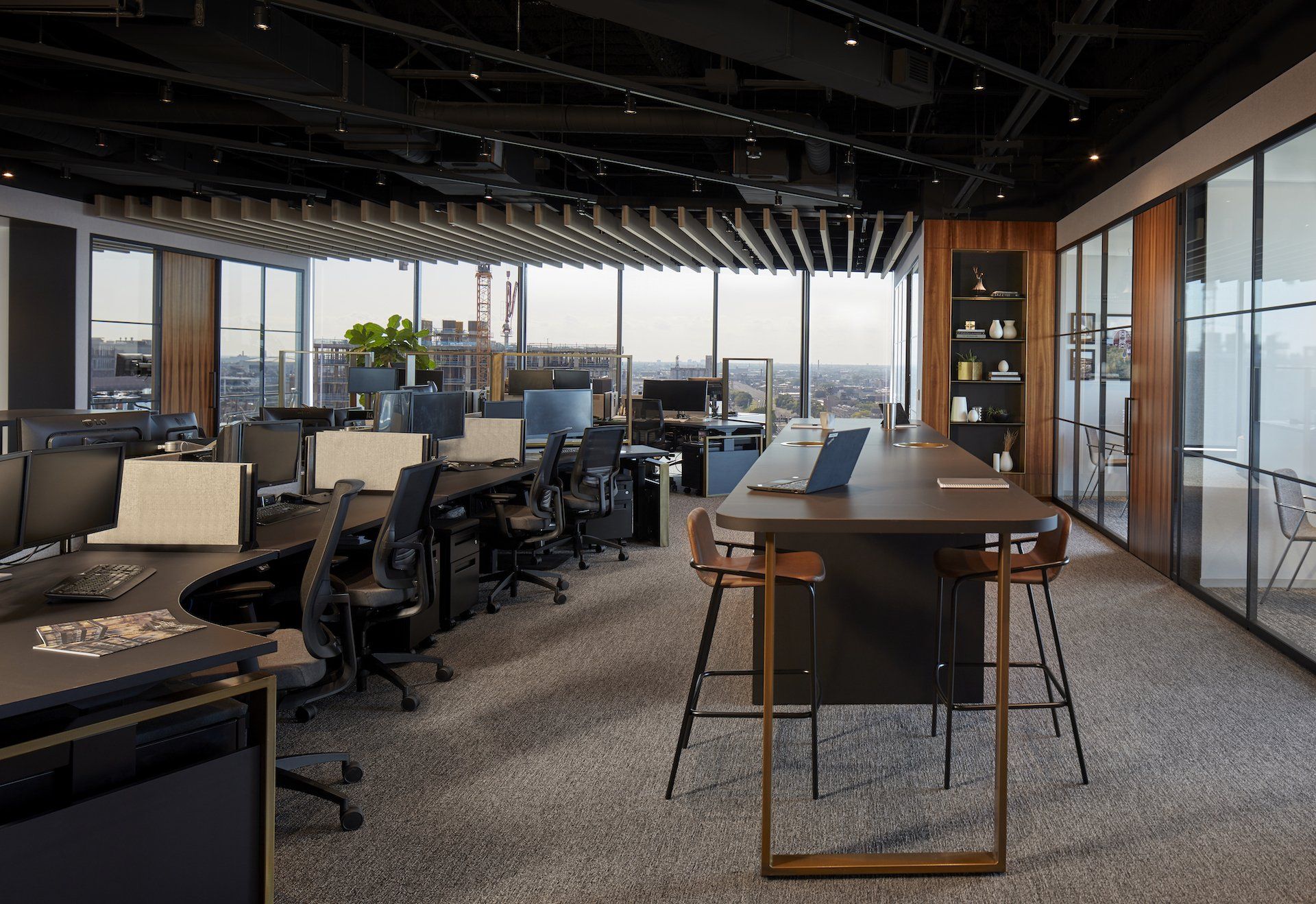 An artist 's impression of an office with a long table and chairs.