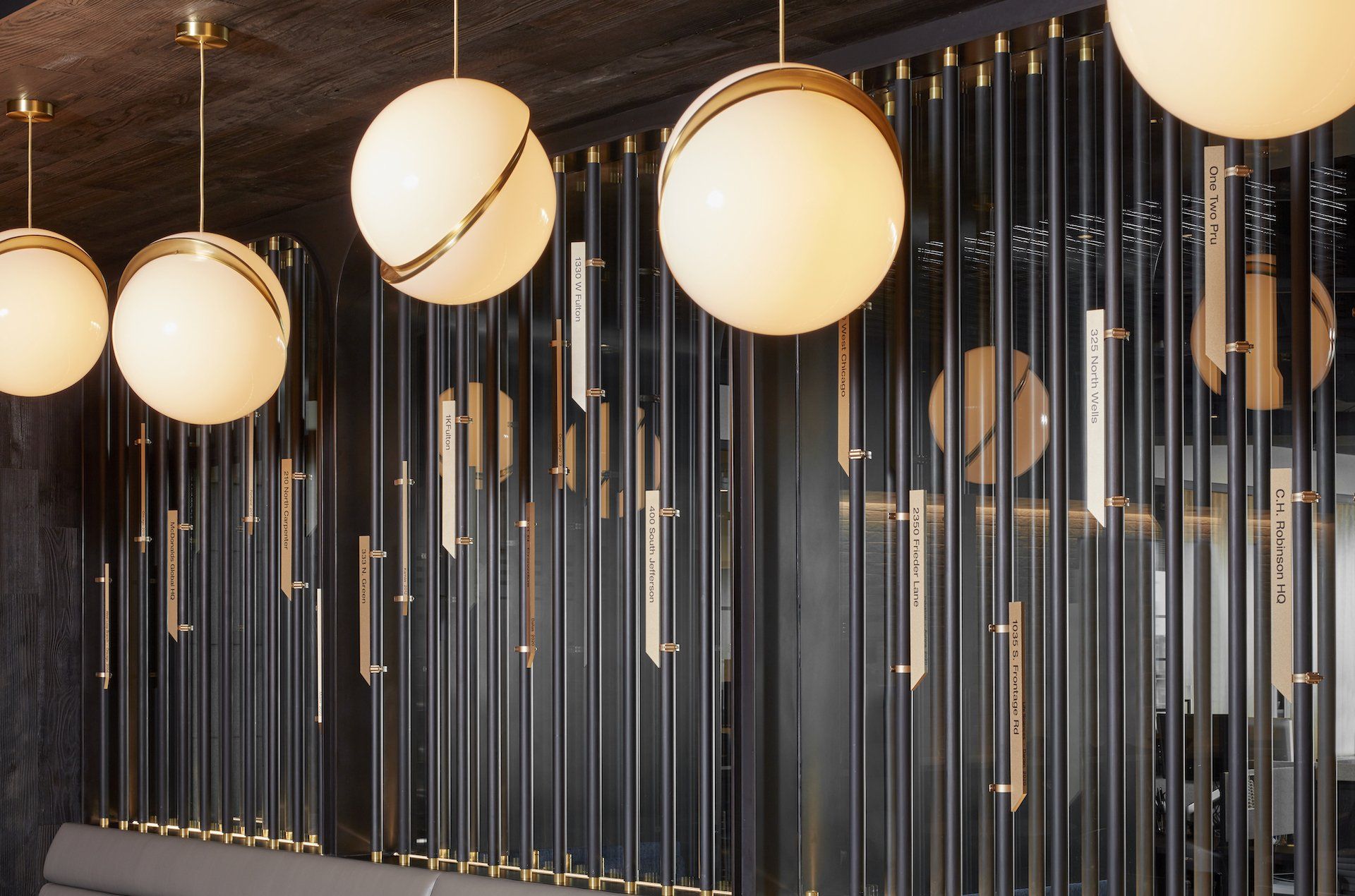 A room with a row of lights hanging from the ceiling