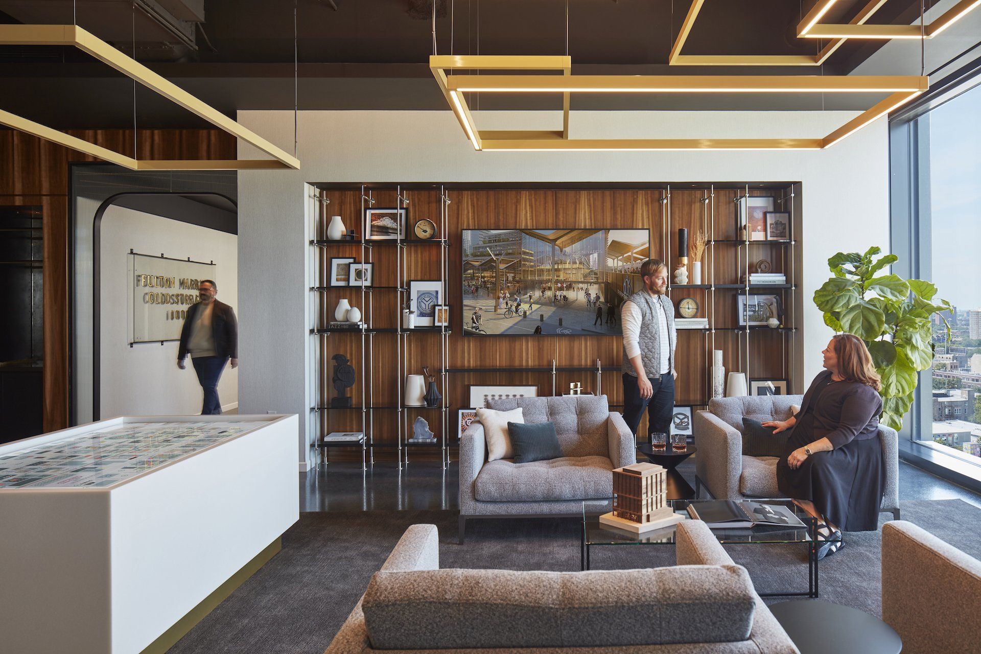 A group of people are sitting in a living room.