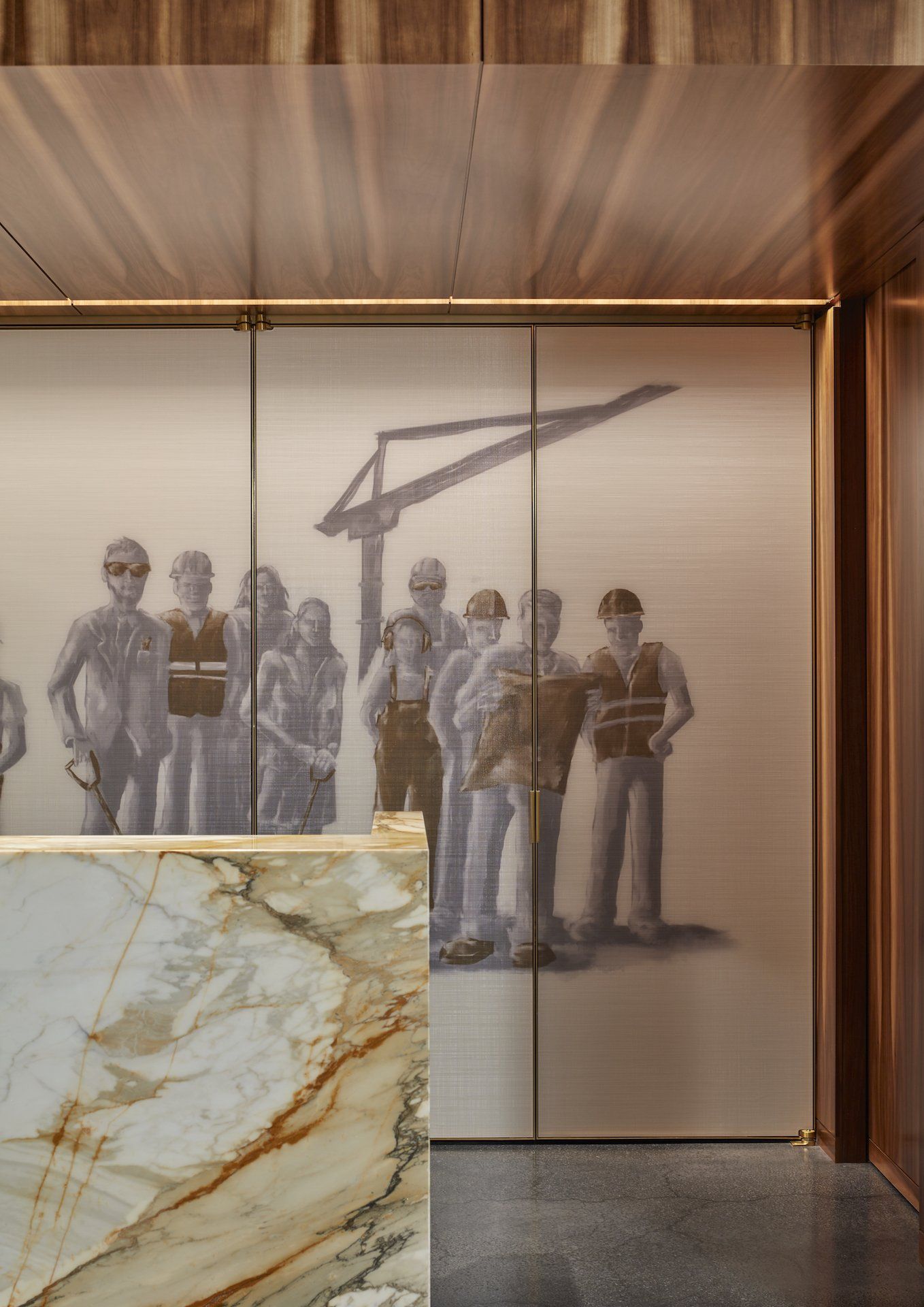 A group of construction workers standing next to each other on a wall