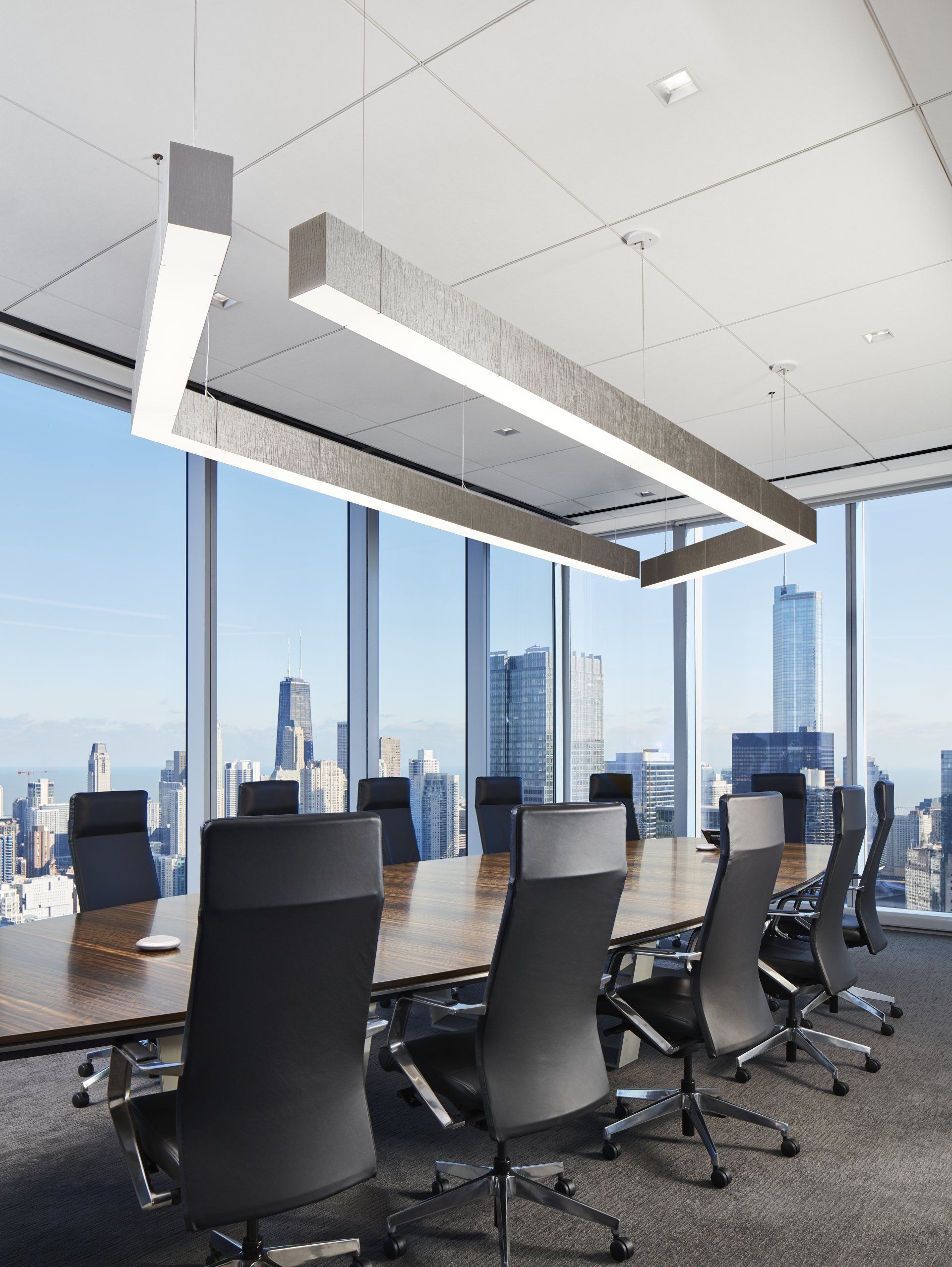 A conference room with a long table and chairs