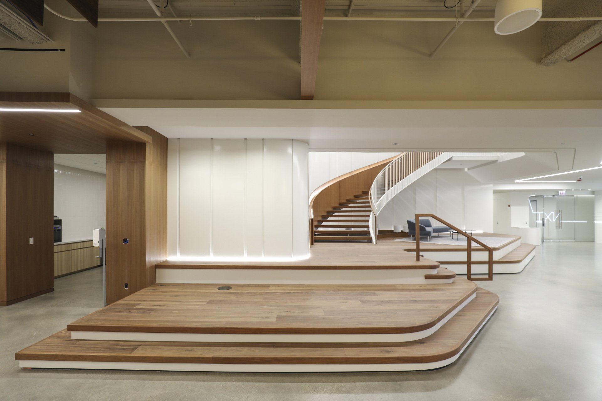 There is a spiral staircase in the middle of the room.