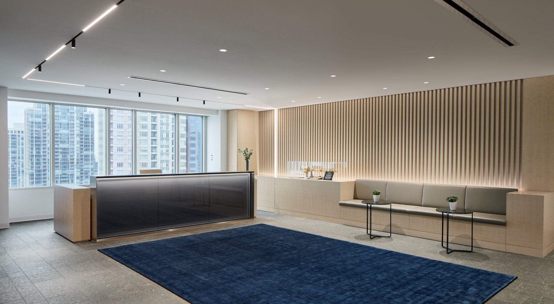 There is a blue rug in the middle of the room.