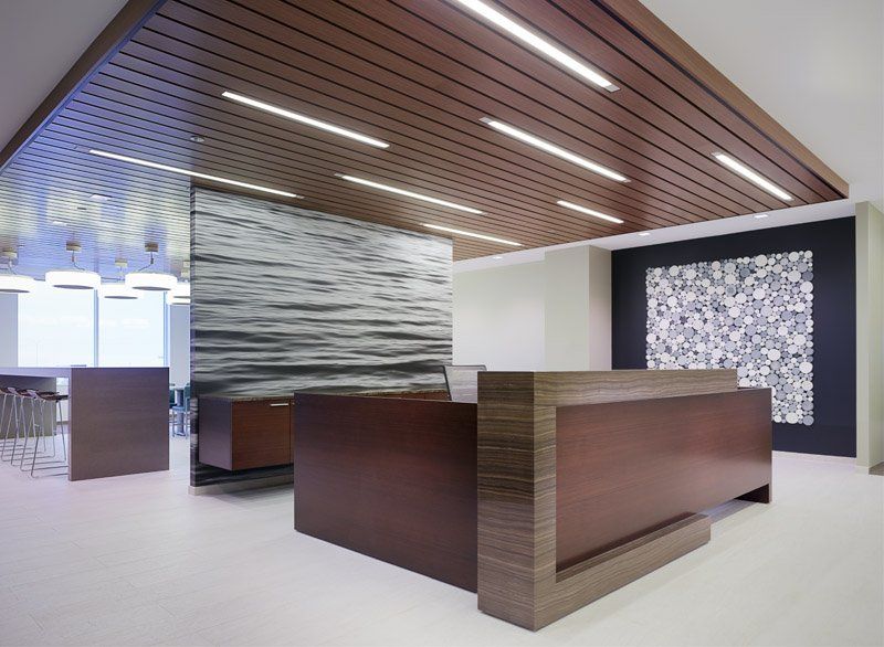 A reception area with a large wooden counter