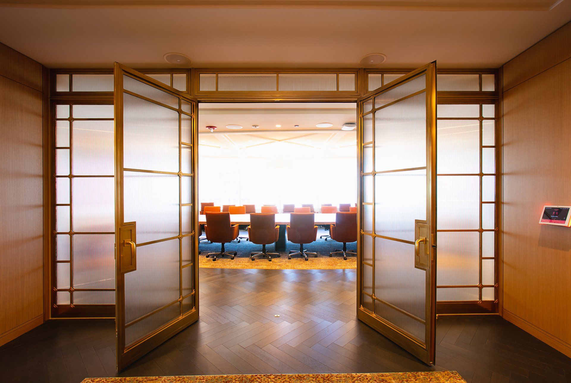 A conference room with a table and chairs in it