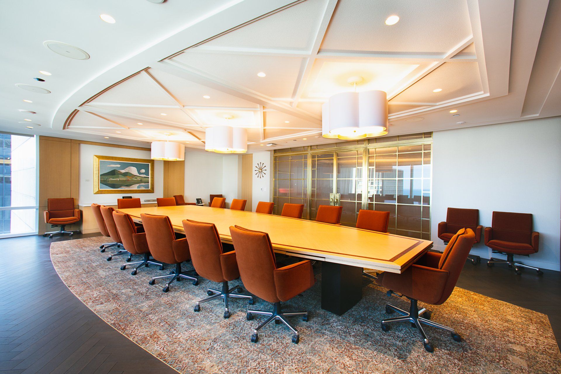 A conference room with a long table and chairs