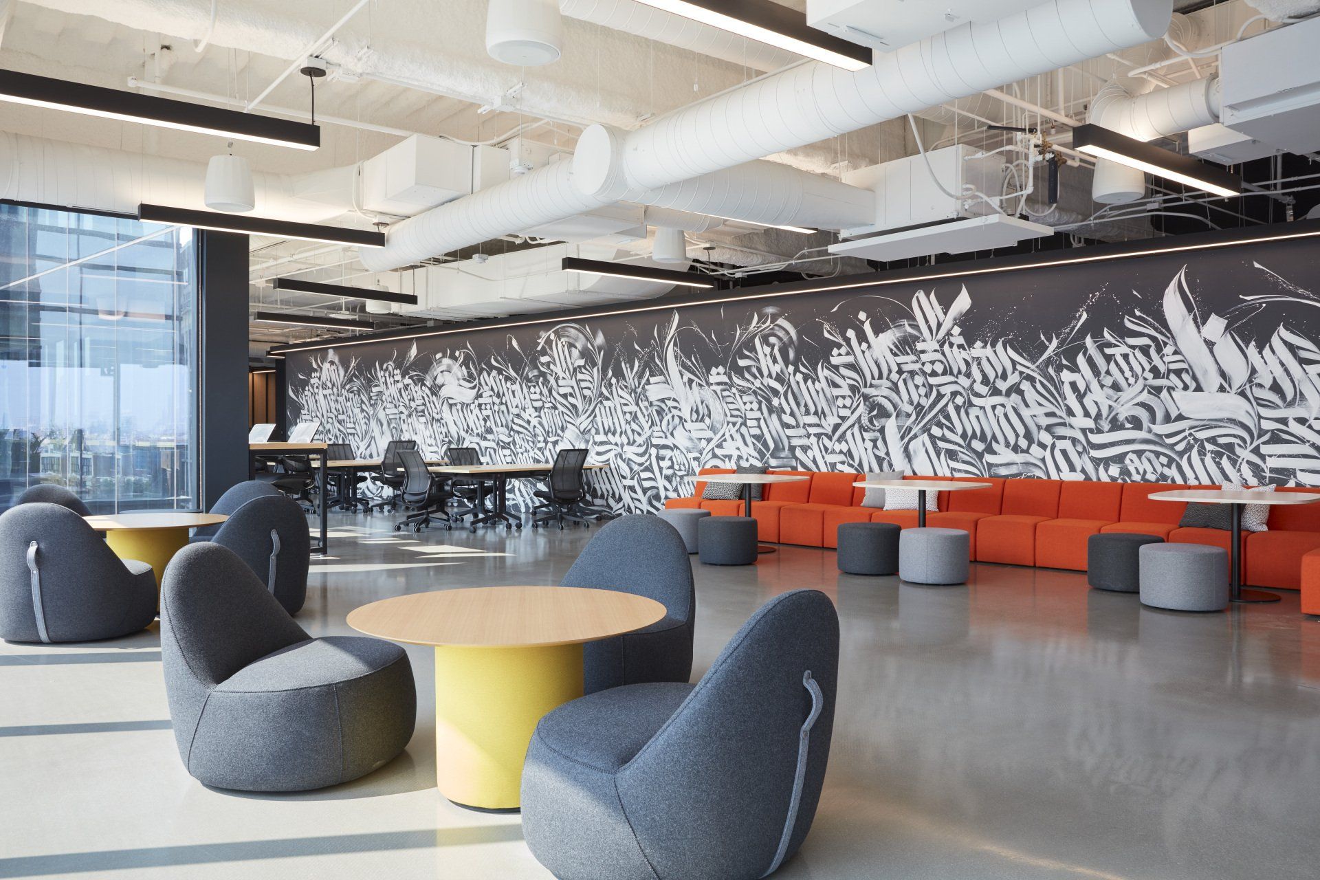 A large room with tables and chairs in it