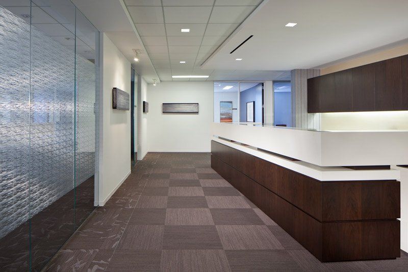 A long hallway with a reception desk in the middle