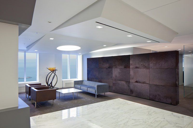 A living room with a couch and chairs in it