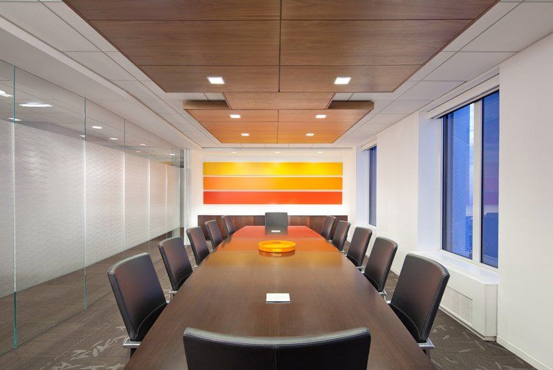 A conference room with a long table and chairs