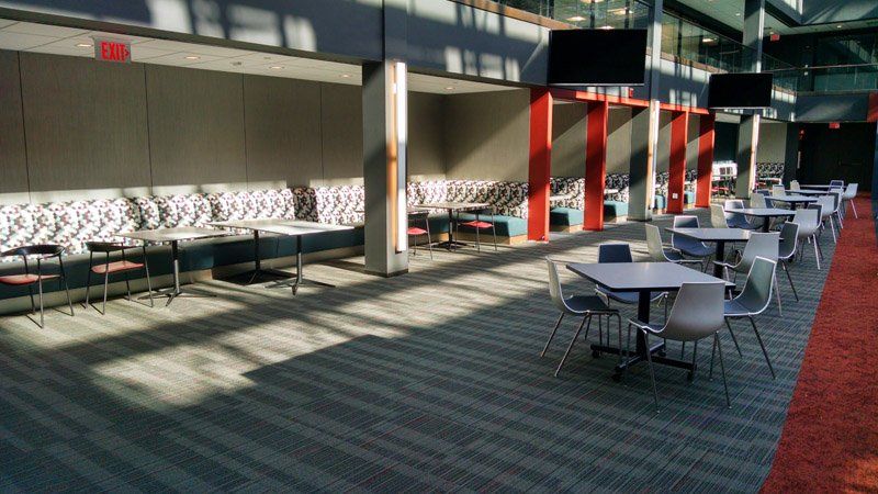 A large room with tables and chairs in it