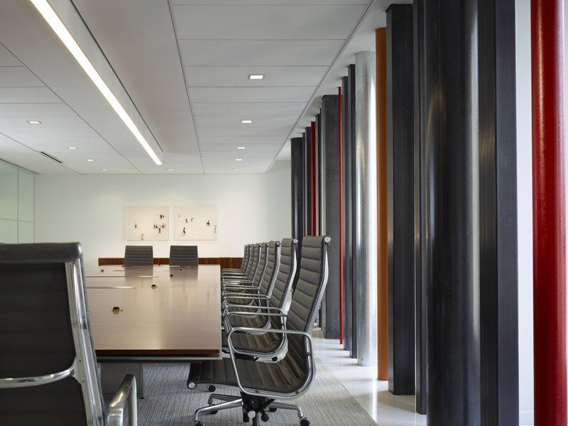 A conference room with a long table and chairs