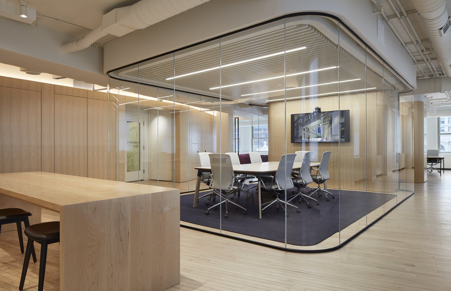 A conference room with a table and chairs in it.